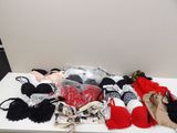 a white table with a bunch of bras on top of it