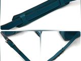 two pictures of a blue bag with a strap on it