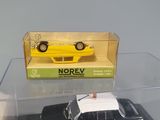 a black and white police car and a yellow police car in a display case