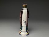 an image of a ceramic figurine of a man holding a bottle