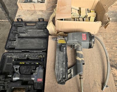 a box of tools sitting on a table next to a box of tools