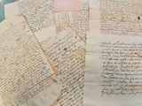 a lot of old papers that are on a table