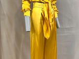yellow satin jumpsuit with belted waist and tie belt