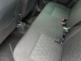 the interior of a car with the seat up and the front seats down