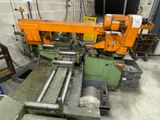 a machine that is working on a piece of wood