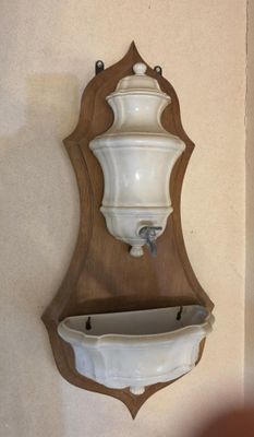 a picture of a wall mounted shelf with a vase on it