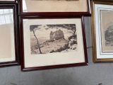 three framed pictures hanging on the wall of a room