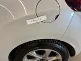 a white car with a sticker on the side of it