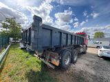 a dump truck that is parked on the side of the road