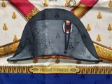 a picture of a hat with a sword on top of it
