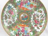 a plate with a picture of people and flowers on it