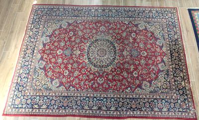an oriental rug on the floor with a wooden floor in front of it