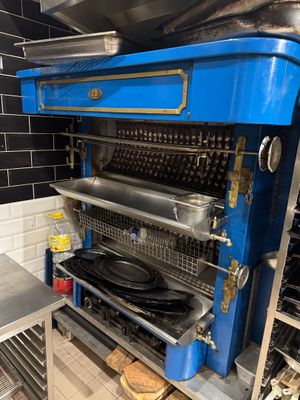 an image of a kitchen with a large blue stove