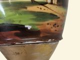 a vase with a painting on it sitting on a stand