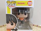 a close up of a pop vinyl figure in a box on a table