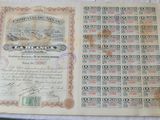 an old paper with a lot of stamps on it sitting on top of a table