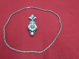 necklace and earring on a red cloth