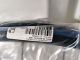 a blue toothbrush in a plastic bag on a counter