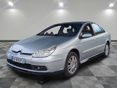 a picture of a silver car parked in a garage