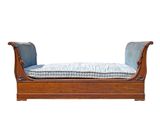 an image of a wooden bench with a blue cushion