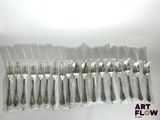 a lot of spoons and forks in a plastic bag