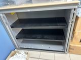 a metal cabinet that has a bunch of items in it