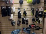 a picture of a bike shop with a lot of gloves on the wall