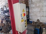 a machine that is sitting in a room with a lot of junk