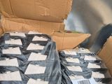 a cardboard box filled with a lot of black and white items