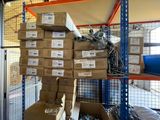 a large stack of boxes on a shelf in a warehouse