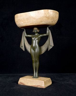 an image of a statue of a woman holding a bowl on her head