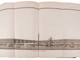 an open book with a picture of a building in the background