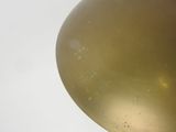 a gold balloon that is flying in the sky