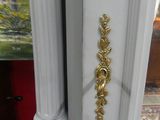 a white door with a gold door handle on it