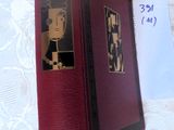 a red book with a picture of a man on it