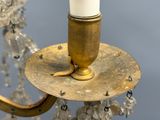 a candle that is sitting on top of a chandelier