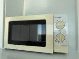 a microwave that is sitting on a counter in a kitchen