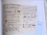 an open book with music notes on it and a price tag