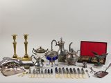 a lot of silverware on a table with a red box