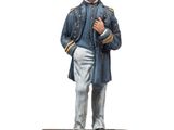 statue d'un homme vêtu d'un manteau bleu et d'un chapeau, debout sur un socle en bois