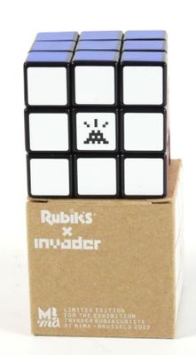 a rubik cube that is sitting on top of a cardboard box