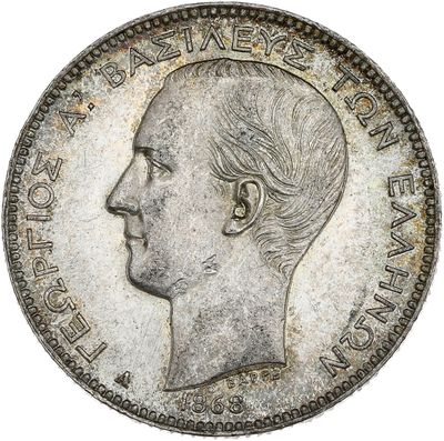 Gros plan sur une pièce de monnaie portant le visage d'un homme