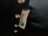 a close up of a black hat with studs on it
