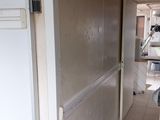 a white refrigerator and a white refrigerator freezer in a room