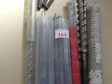 many different types of screws and screws on the table