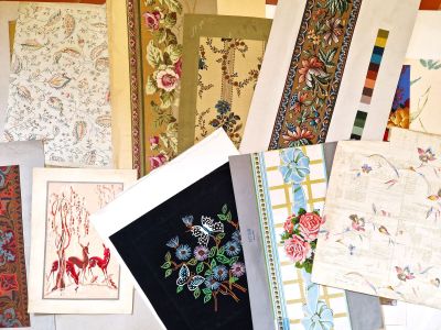 a lot of different types of rugs on the floor