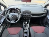 the interior of a small car with a steering wheel and dashboard
