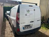 a van that is parked in the driveway of a house