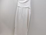a picture of a white dress hanging on a hanger