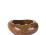 an image of a wooden bowl sitting on top of a white surface
